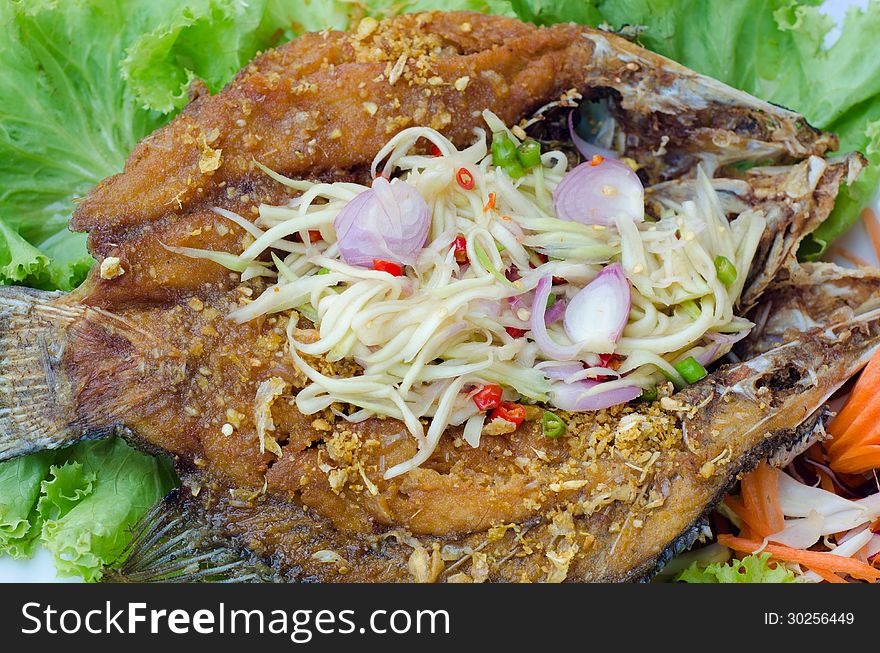 Tilapia fish fried with mango salad. Tilapia fish fried with mango salad