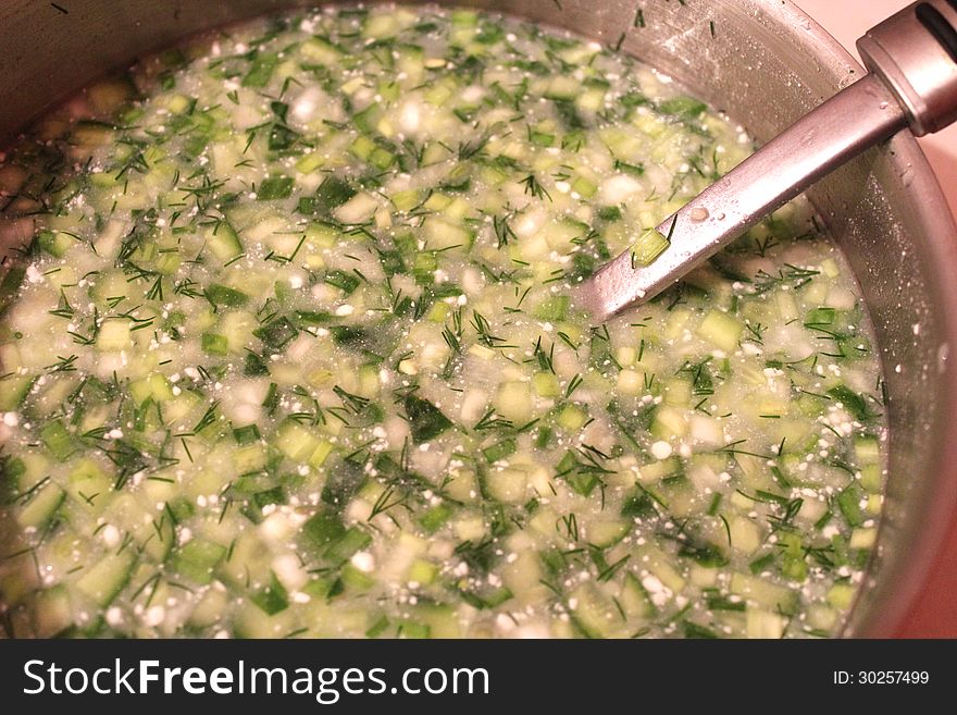 Image of dish of fresh okroshka with spoon