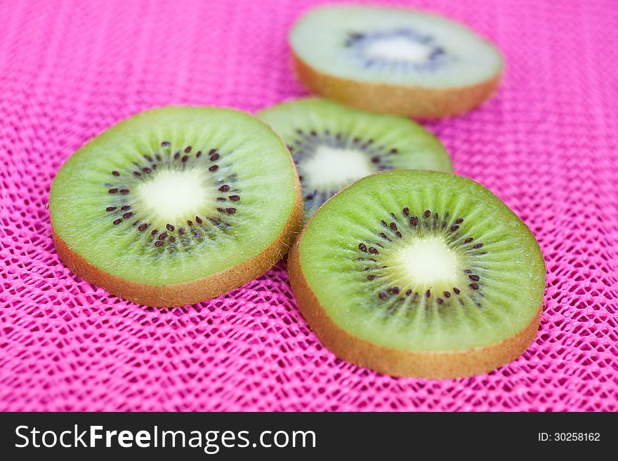 Kiwi fruit on pink background
