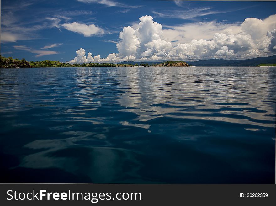 Multicolor sky, transparent sea and islands on archipelago Flores, Indonesia. Multicolor sky, transparent sea and islands on archipelago Flores, Indonesia