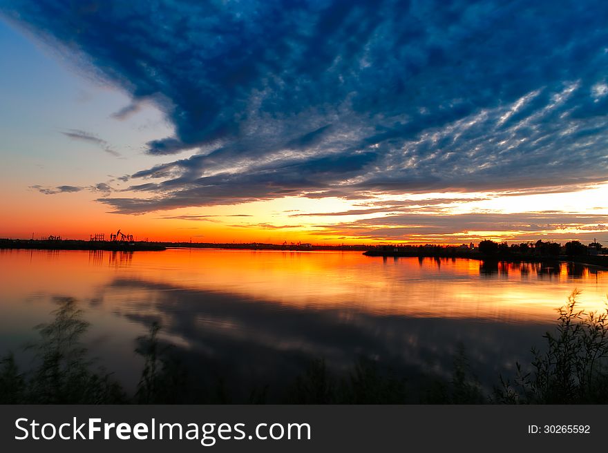 It is Daqing oil field scenery.Heilongjiang province,china.The clouds pointing oil well. It is Daqing oil field scenery.Heilongjiang province,china.The clouds pointing oil well.