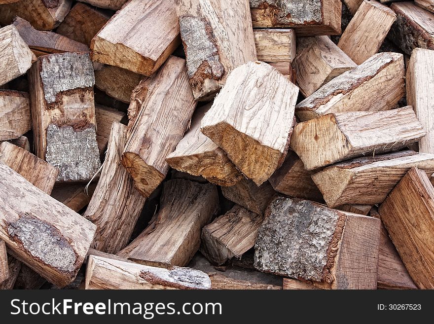 Dry, ragged firewood, ready for winter. Dry, ragged firewood, ready for winter