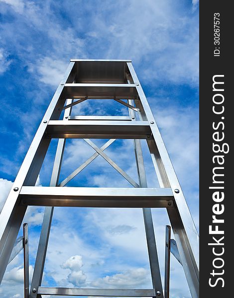 Stainless steel ladder and blue sky. Stainless steel ladder and blue sky