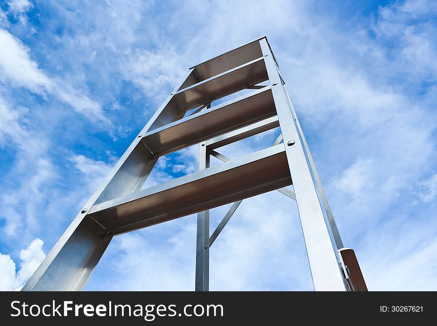 Stainless steel ladder and blue sky background