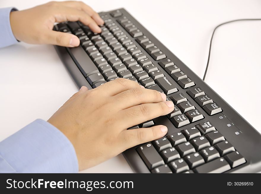 Hands typing on keyboard. This is office environment concept