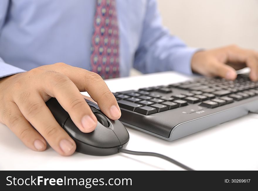 Hands typing on keyboard. This is office environment concept