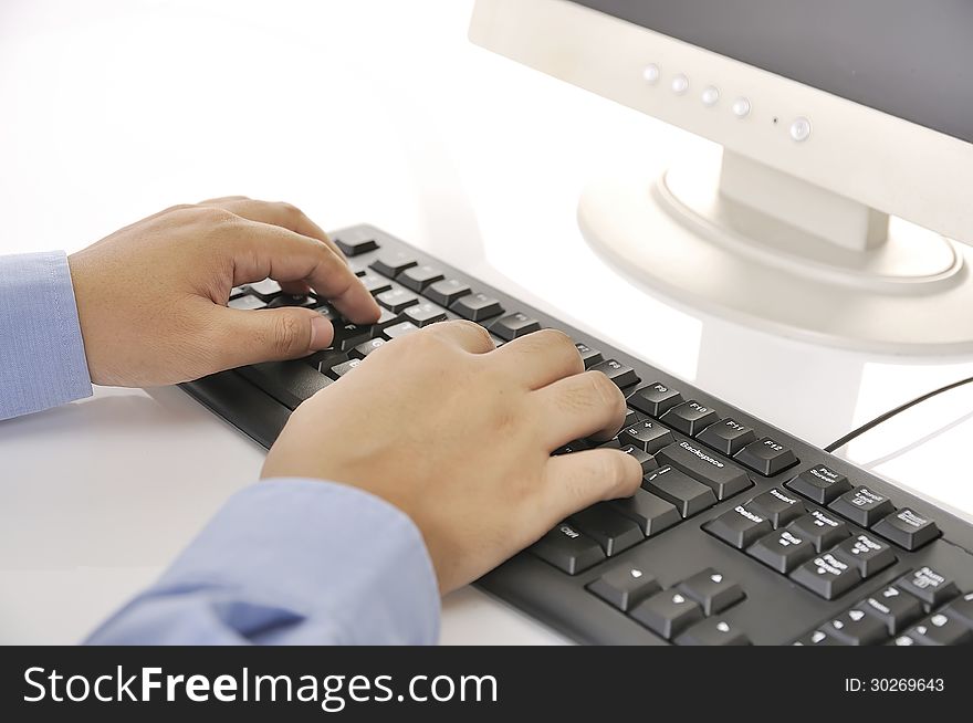 Hands typing on keyboard. This is office environment concept