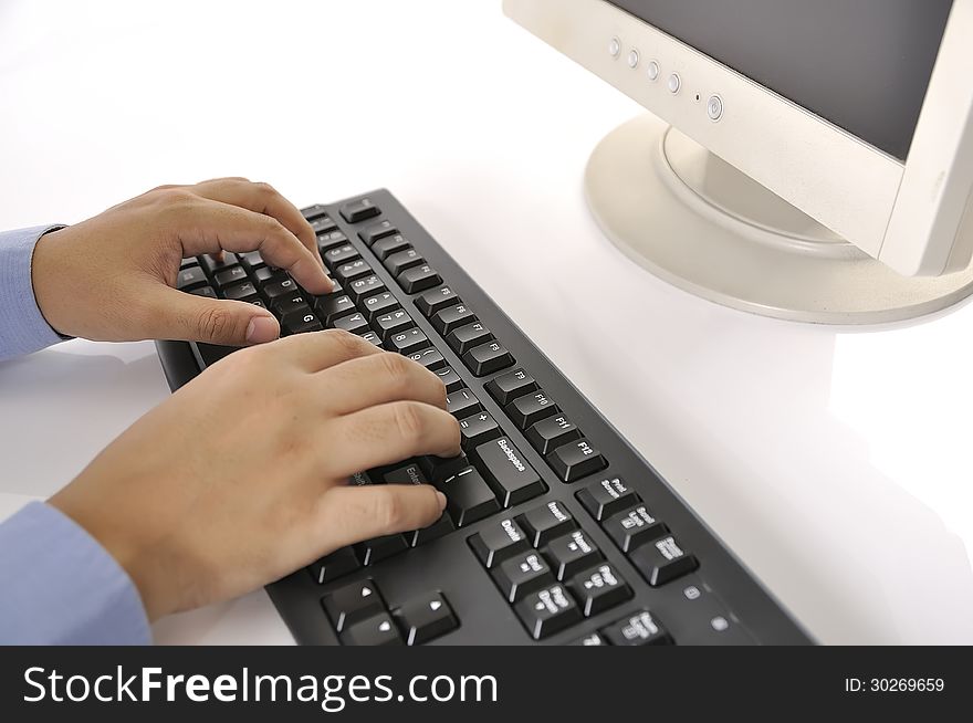 Hands typing on keyboard. This is office environment concept