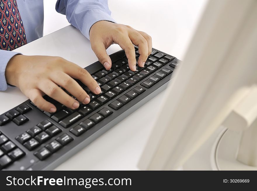 Hands typing on keyboard. This is office environment concept