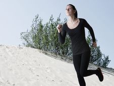 Woman In Black Running Over Sand Dunes Stock Images Woman In Black Running Over Sand Dunes Stock Images
