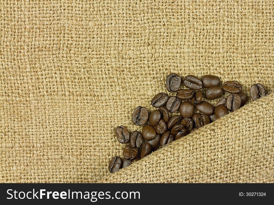 Coffee beans on sack closeup. Coffee beans on sack closeup