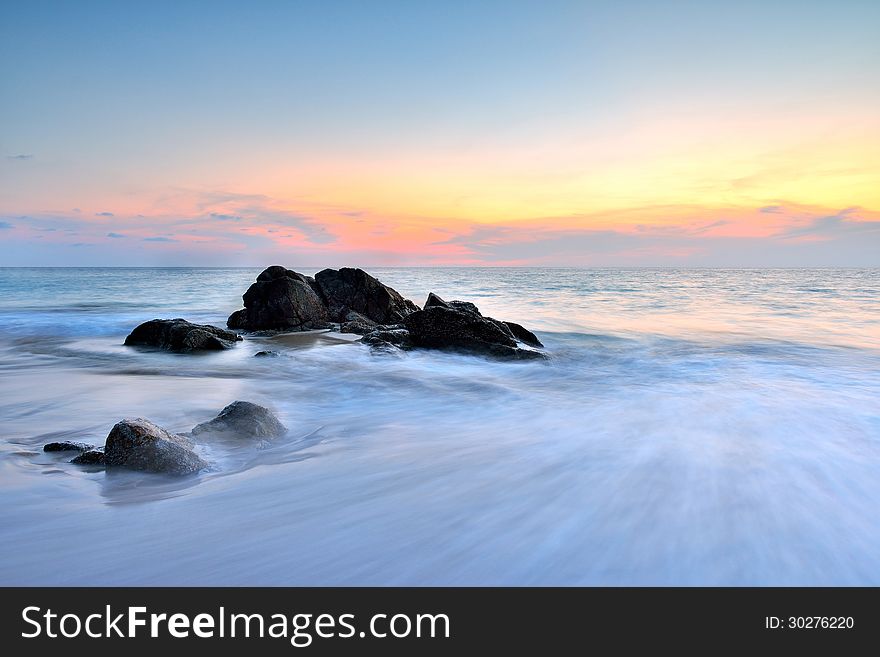 Sea wave on the beach at sunset time. Sea wave on the beach at sunset time