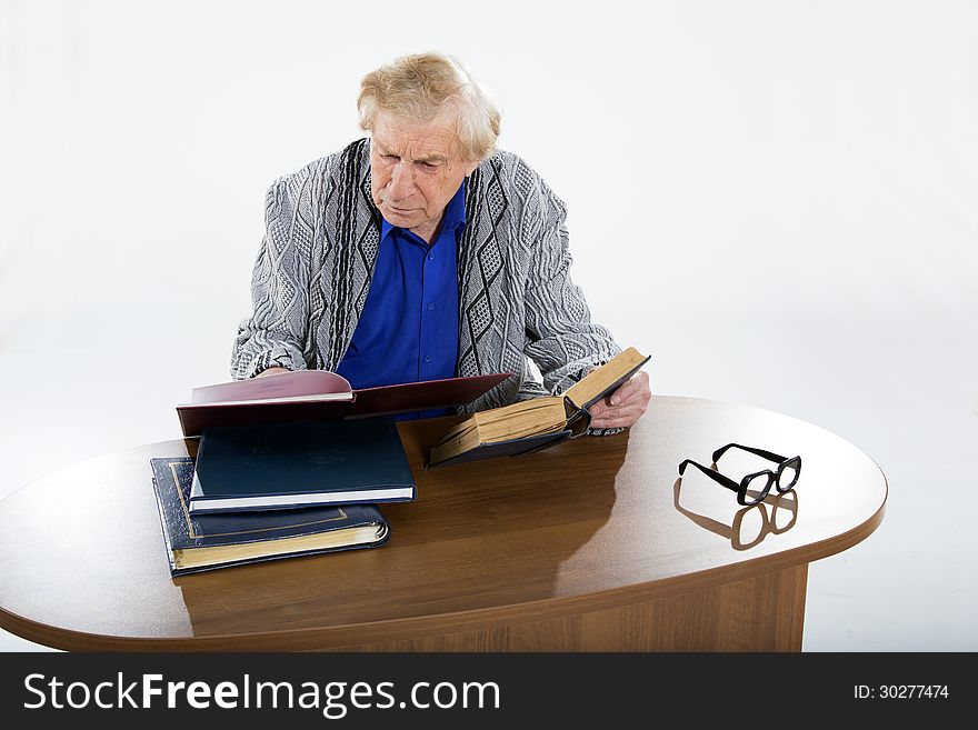 Face portrait of a smiling senior man sitting in an armchair. Face portrait of a smiling senior man sitting in an armchair