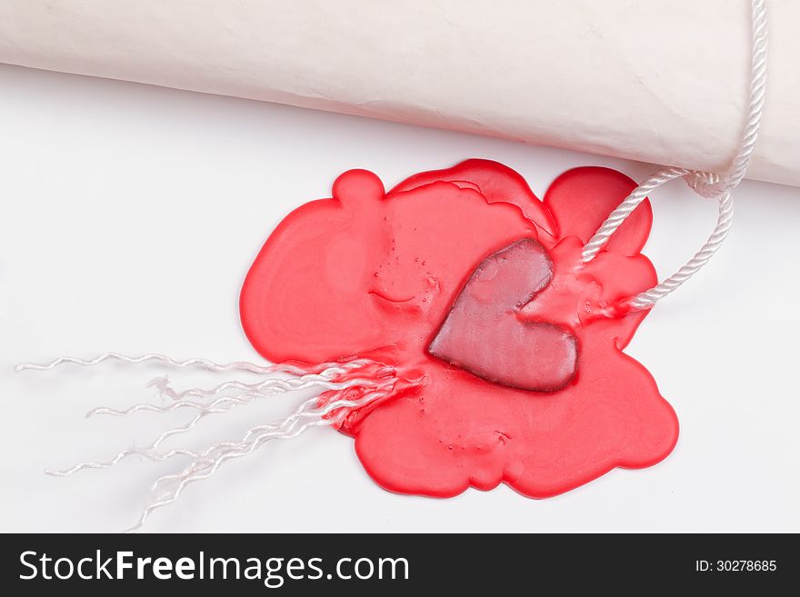Love letter sealed the seal in the form of heart in red sealing wax