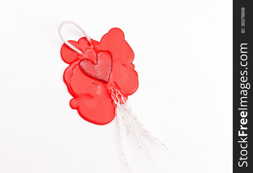 Mark in the shape of a heart made of red sealing wax