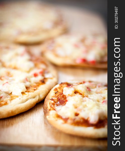 Homemade pizza with shrimp and cheese. Close-up. Homemade pizza with shrimp and cheese. Close-up.