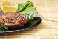 Grilled Steak With Salad And Lemon On Black Plate With Fork Stock Photos Grilled Steak With Salad And Lemon On Black Plate With Fork Stock Photos