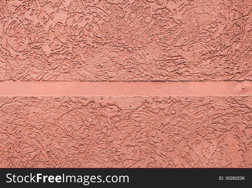 Pink textured plaster with a smooth strip in the middle. Pink textured plaster with a smooth strip in the middle