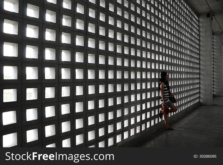 Beautiful woman with a very sad expression in dramatic space