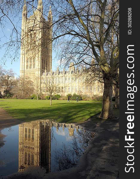 Victoria Tower reflected in puddle, Palace of Westminster, London