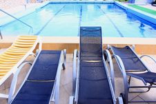 Pool And Sunbeds Royalty Free Stock Photos