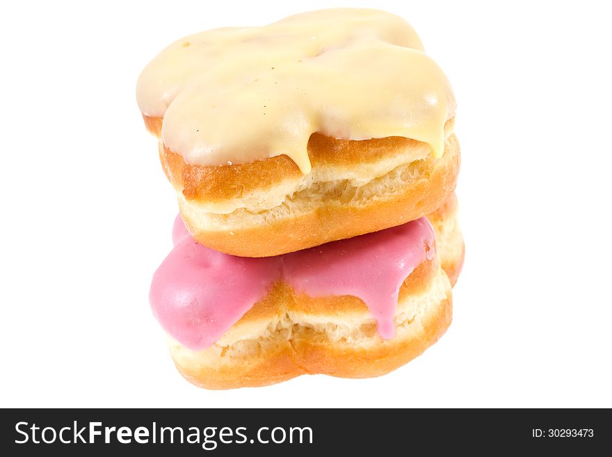 Two Doughnuts with banana and strawberry glaze isolated on white. Two Doughnuts with banana and strawberry glaze isolated on white