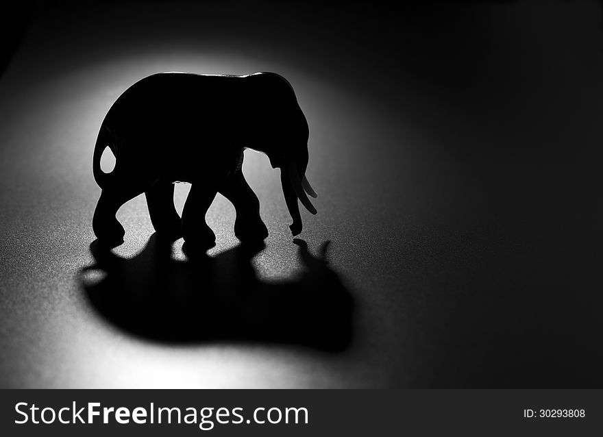 Elephant figure on a dark background