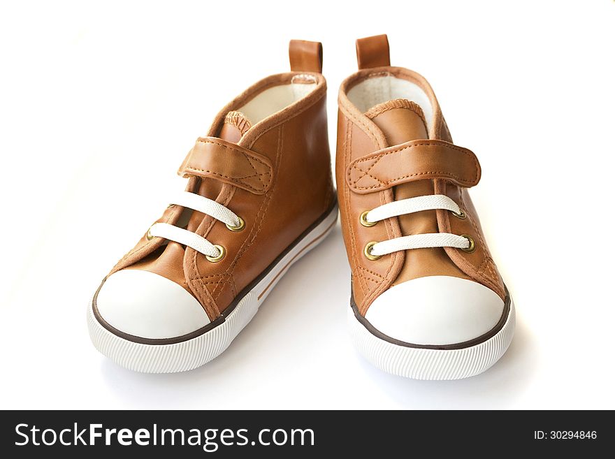 Pair of brown sneakers on white background. Pair of brown sneakers on white background