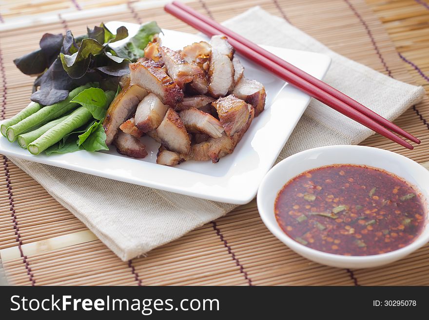 Pork grilled slice on white dish. Pork grilled slice on white dish