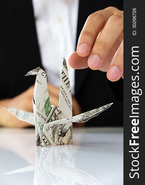 Origami paper cranes, money concept