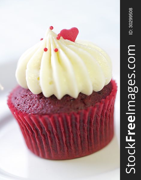A popular Red Velvet cupcake in a shallow depth of field.
