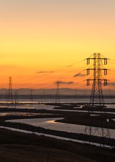 Sunset Water And Towers Royalty Free Stock Photography