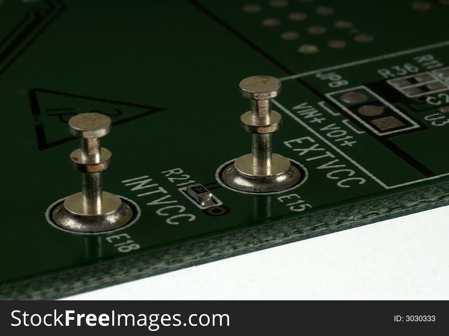 Close up detail of a Printed Circuit Board on a white background