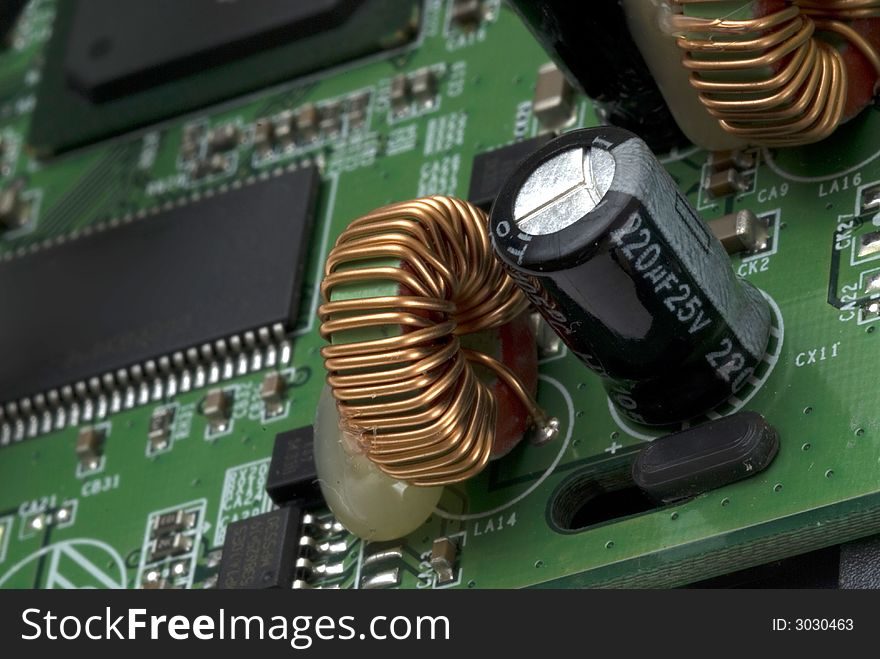 Close up detail of a Printed Circuit Board on a white background