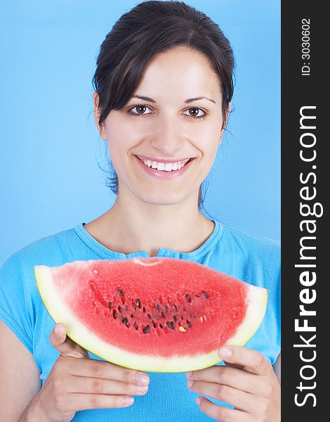 Young girl  with watermelon isolated on blue background. Young girl  with watermelon isolated on blue background