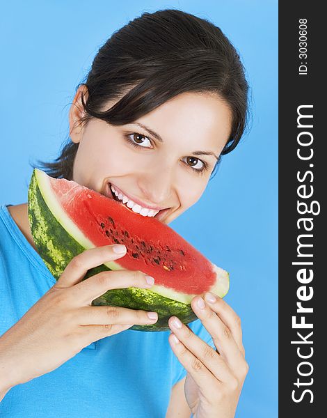 Young girl  with watermelon isolated on blue background. Young girl  with watermelon isolated on blue background