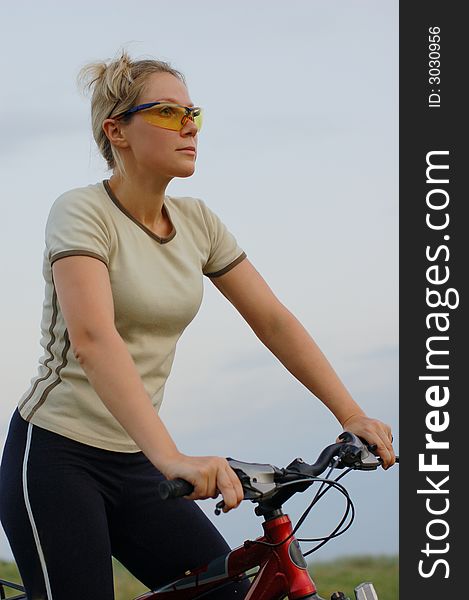 A girl biking at sunset