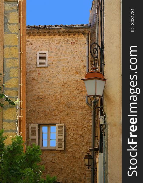 Mediterranean façades in an old village from the Middle Ages in the south of France.