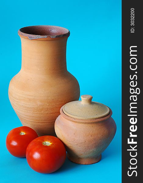 Still life with jugs and tomatos. Still life with jugs and tomatos