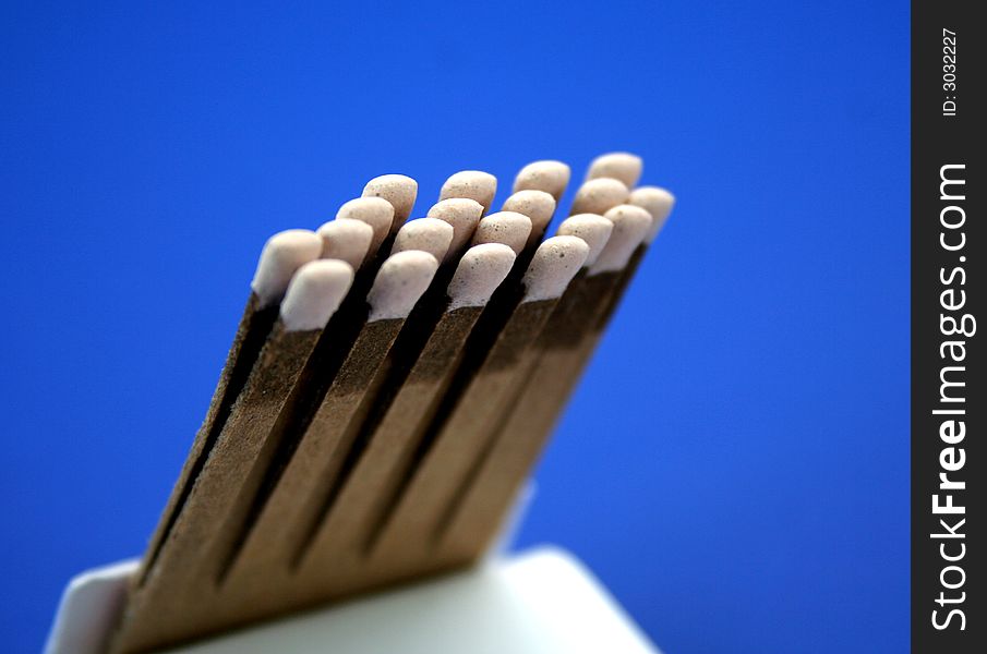 Open book of matches on a blue background. Open book of matches on a blue background