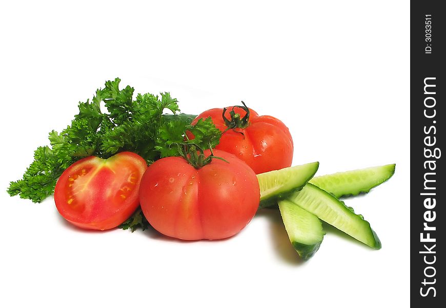 Cucumbers, tomatoes and greens, close up