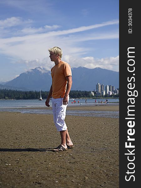 Man standing on the beach in vancouver. Man standing on the beach in vancouver
