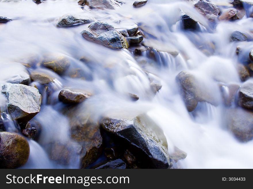 Water flows on the mountain river. Water flows on the mountain river