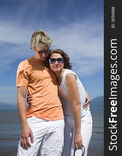 Young couple posing on the beach in vancouver