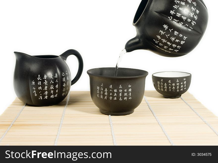 Black matte Chinese tea set with teapot and cup with chinese characters. Black matte Chinese tea set with teapot and cup with chinese characters.