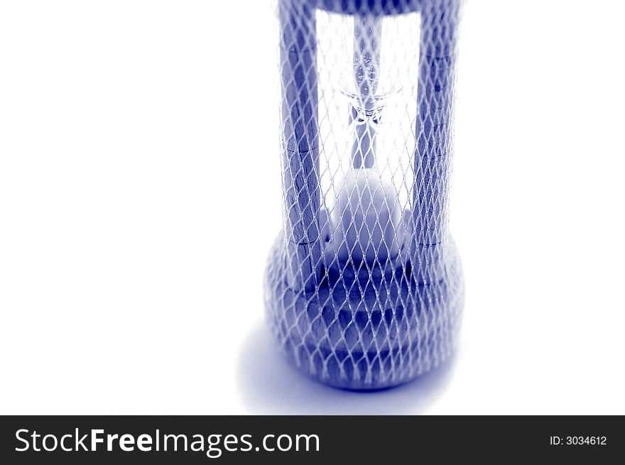 Hourglass covered by a net. Hourglass covered by a net