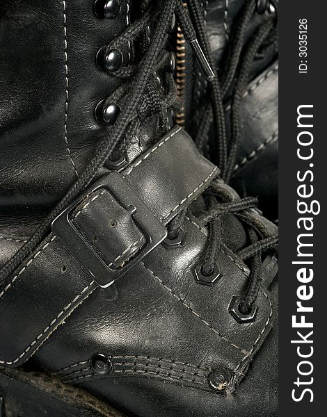 Background image of well worn, dirty, scuffed black boots. Background image of well worn, dirty, scuffed black boots.