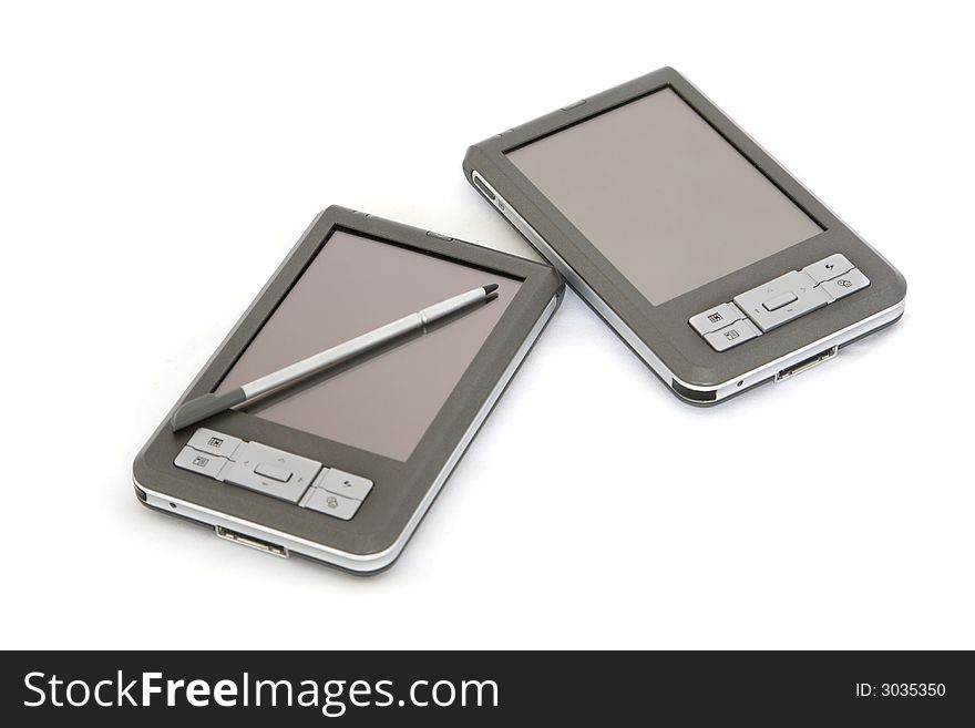 2 PDA's on white, isolated, with one having stylus on screen