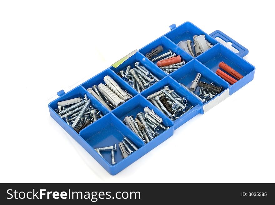 A box with assorted screws and bushes. A box with assorted screws and bushes