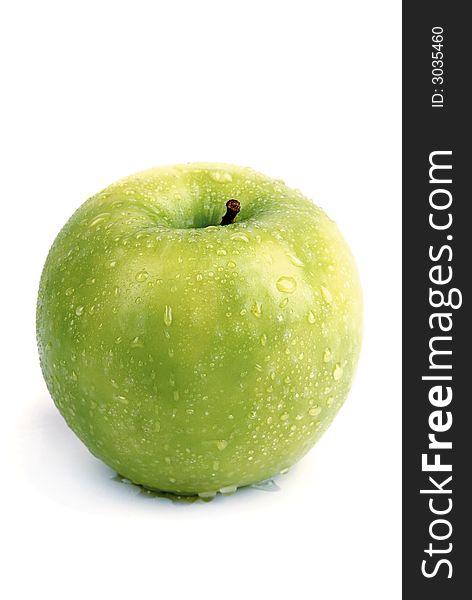 Single green apple, wet and fresh